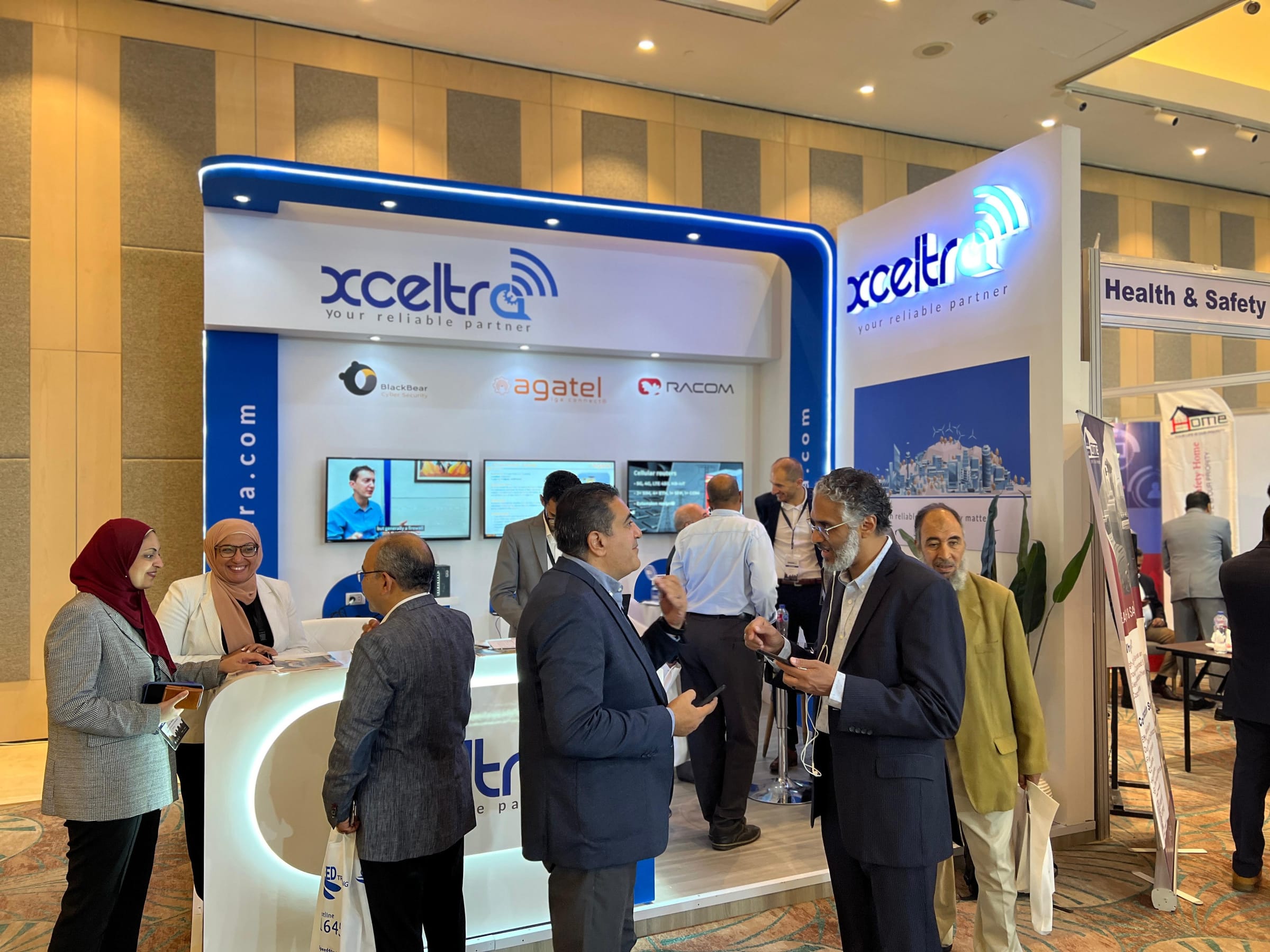 Xceltra booth with Blackbear, Agatel, and Racom at ICE 2024